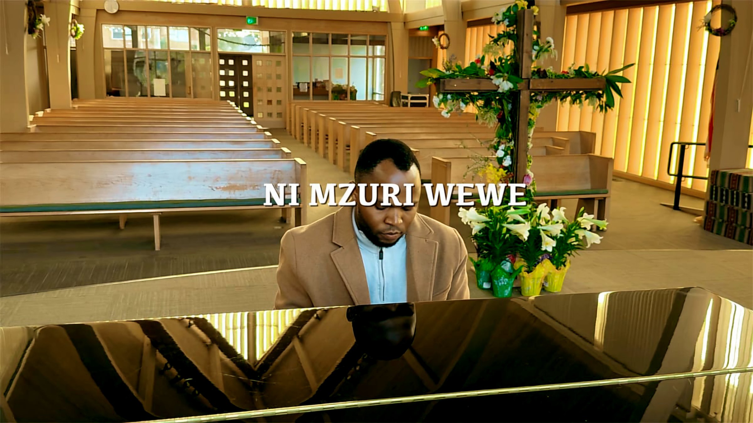 Bernard Joseph Mwambungu leading worship
